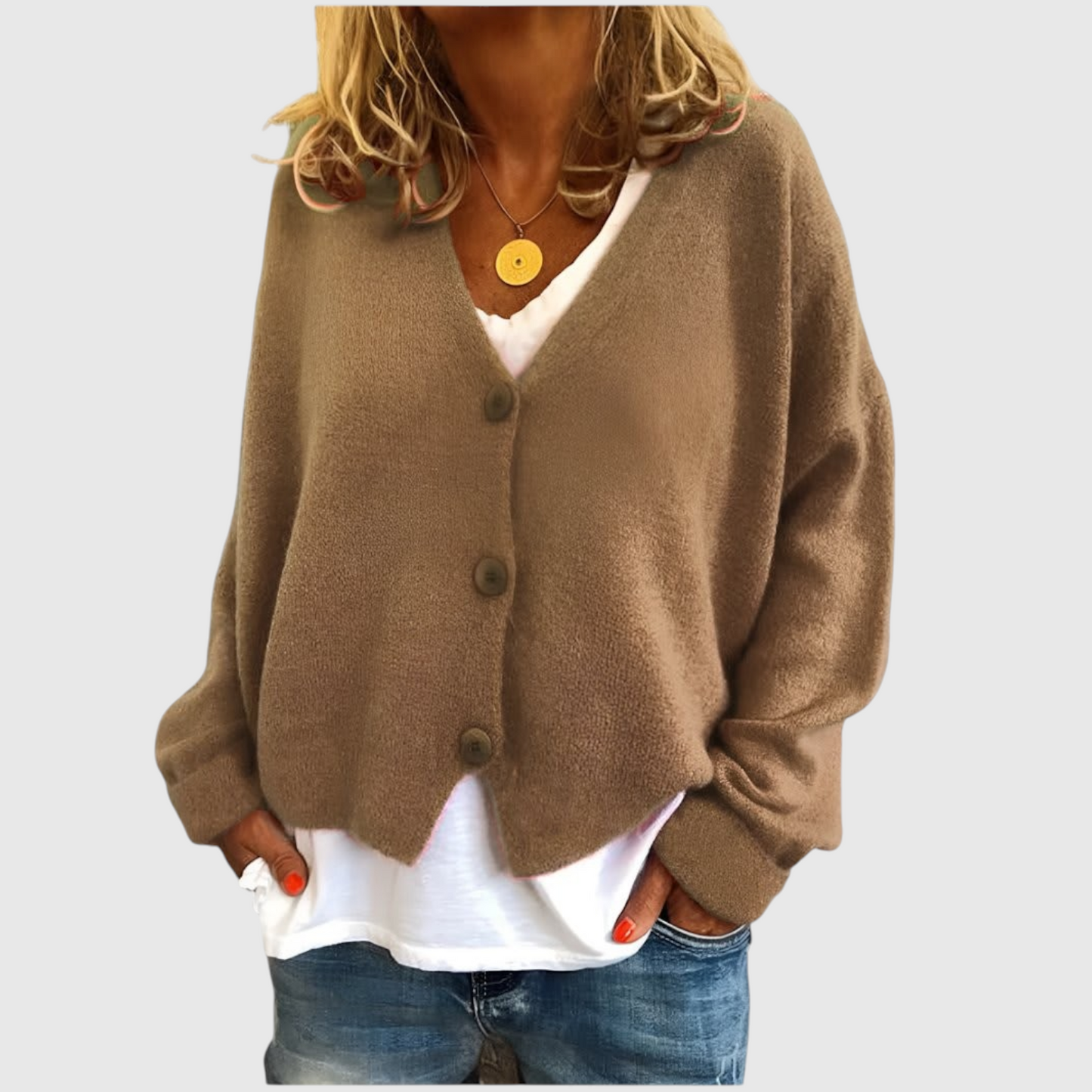 My Store Priska oversized beige knit cardigan with V-neck and button front worn over a white shirt and jeans