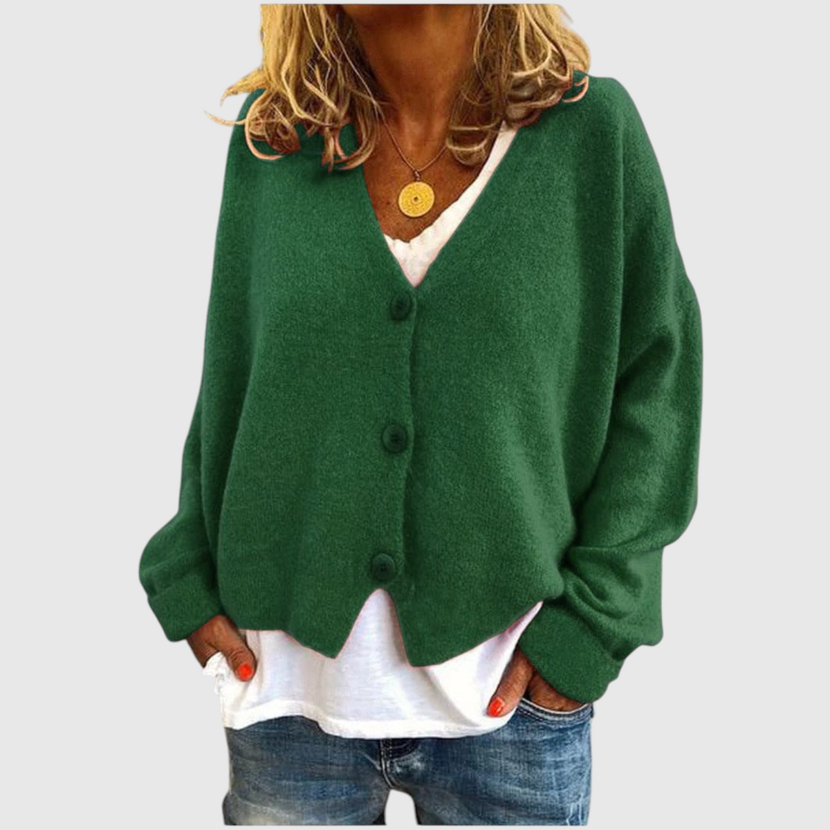 My Store Priska green oversized knit cardigan with V-neck and button front worn over a white shirt and jeans