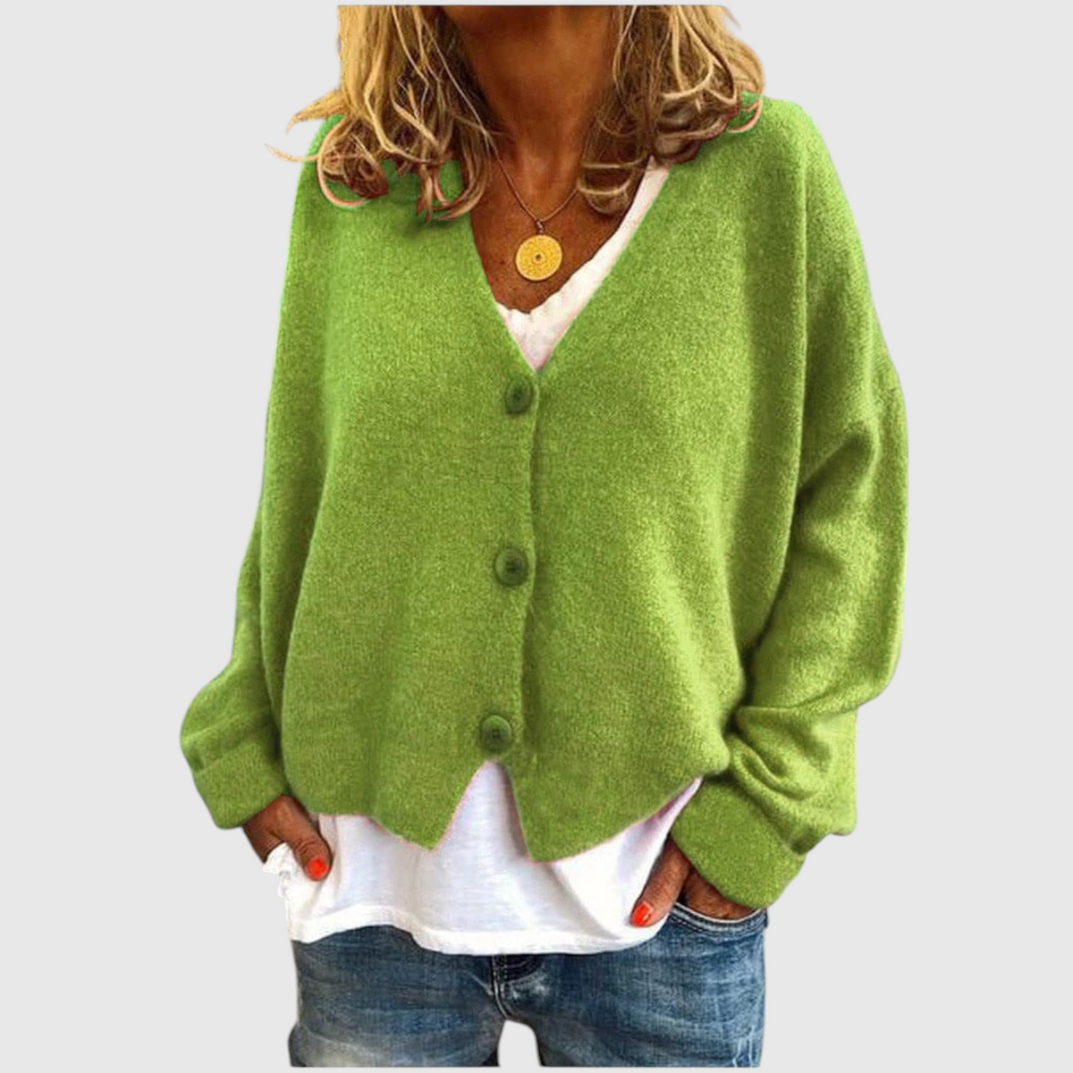 My Store Priska oversized green knit cardigan with V-neck and button front worn over a white shirt and blue jeans