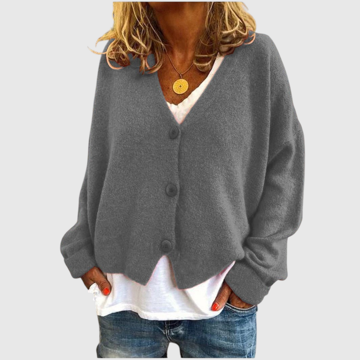 My Store Priska grey oversized V-neck cardigan with button front, worn over a white shirt and jeans.