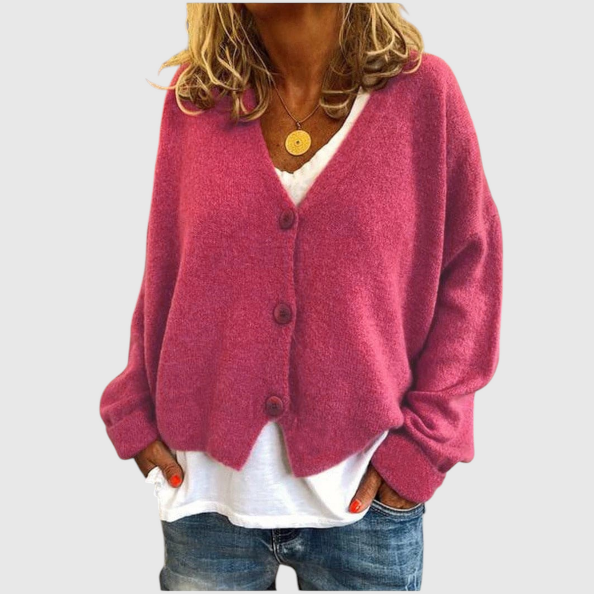 My Store Priska oversized pink knit cardigan with V-neck and button front worn over a white shirt and blue jeans