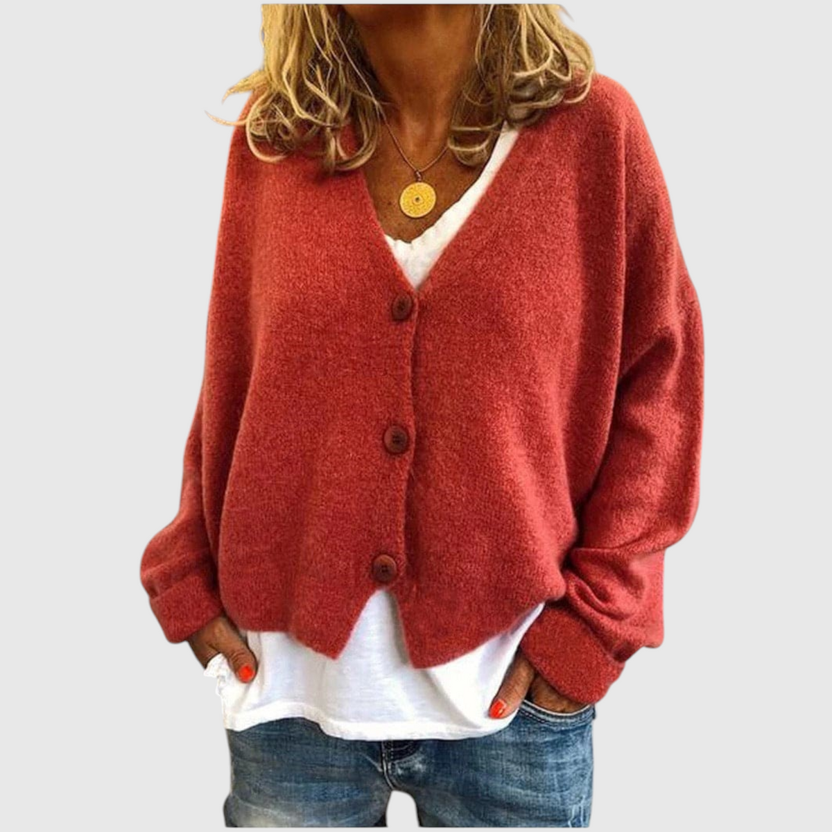 My Store Priska oversized rust-red knit cardigan with V-neck and button front worn over a white shirt and jeans