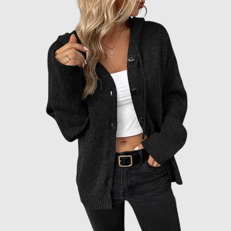 My Store Aline black ribbed knit cardigan with button closure and relaxed fit worn over a white top
