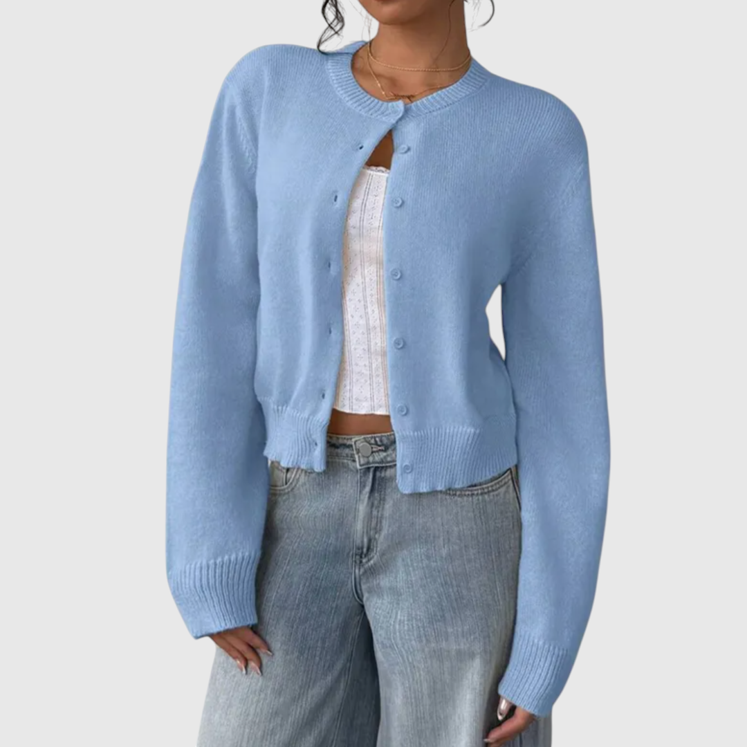 My Store Angelika light blue cropped knit cardigan with a round neckline and button-down front over a white top.