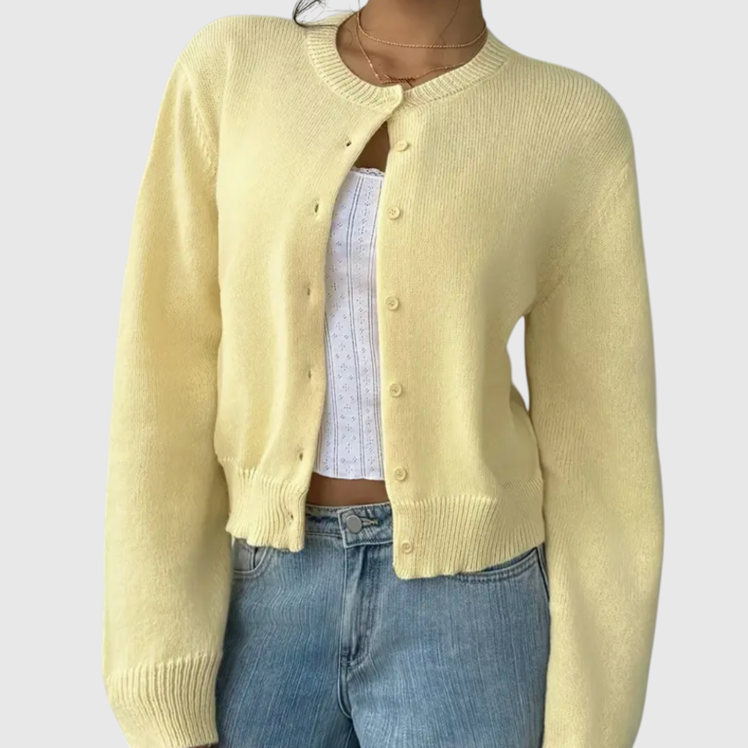 My Store Angelika cropped yellow knit cardigan with crew neck and button front worn over a white top and blue jeans